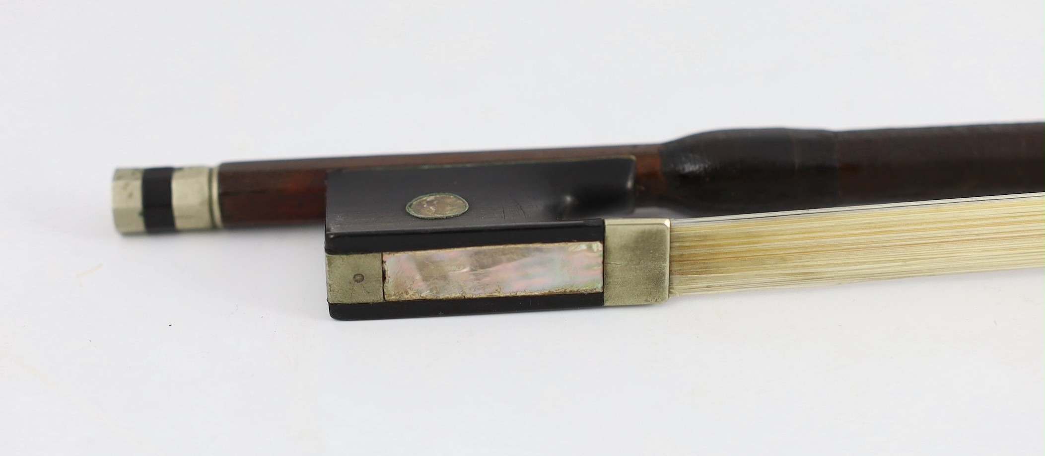 A silver mounted violin bow, stamped DODD, another stamped TOURTE and another bow